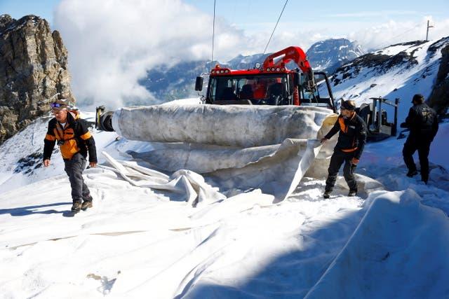 2021-08-27T105630Z_67398980_RC29CO98I1BA_RTRMADP_3_CLIMATE-CHANGE-SWISS-GLACIER.jpg