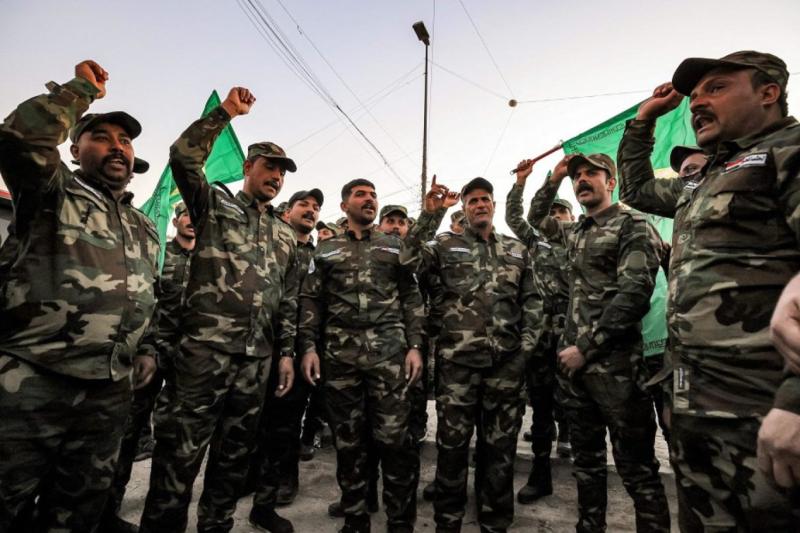 Haşdi Şabi milisleri, Nuceba Hareketi lideri Müştak Talibi El Saidi'nin cenaze merasiminde. Fotoğraf-AFP.jpg
