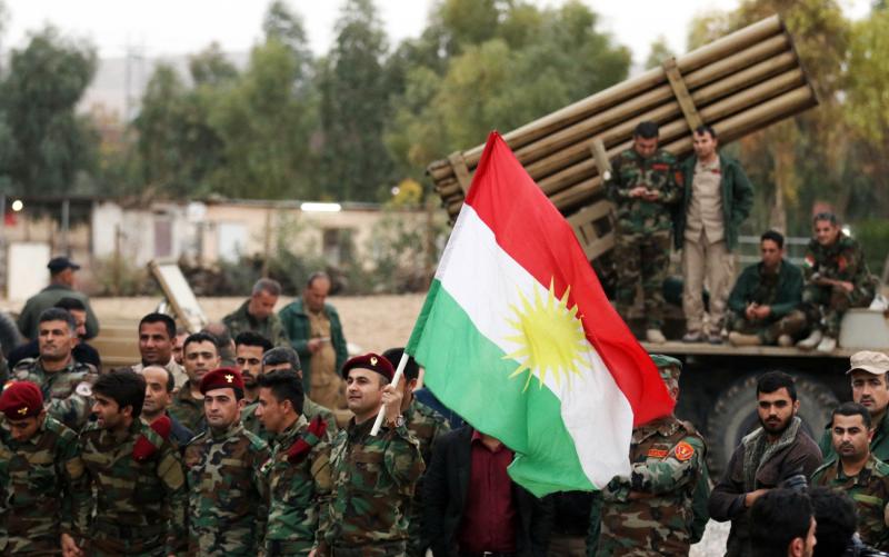 Irak’ın başkenti Bağdat'ın yaklaşık 280 kilometre kuzeyindeki Mahmur'da düzenlenen yeni yıl kutlamalarına katılan Kürt Peşmerge güçleri, 31 Aralık 2017 / Fotoğraf: AFP